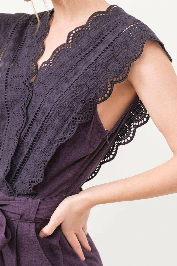 Plum Elegance Lace JumpsuitThe Plum Elegance Lace Jumpsuit is a chic and sophisticated piece that combines elegance with modern style. Featuring a laced surplice neckline and a flattering tie JumpsuitsPlum Elegance Lace Jumpsuit