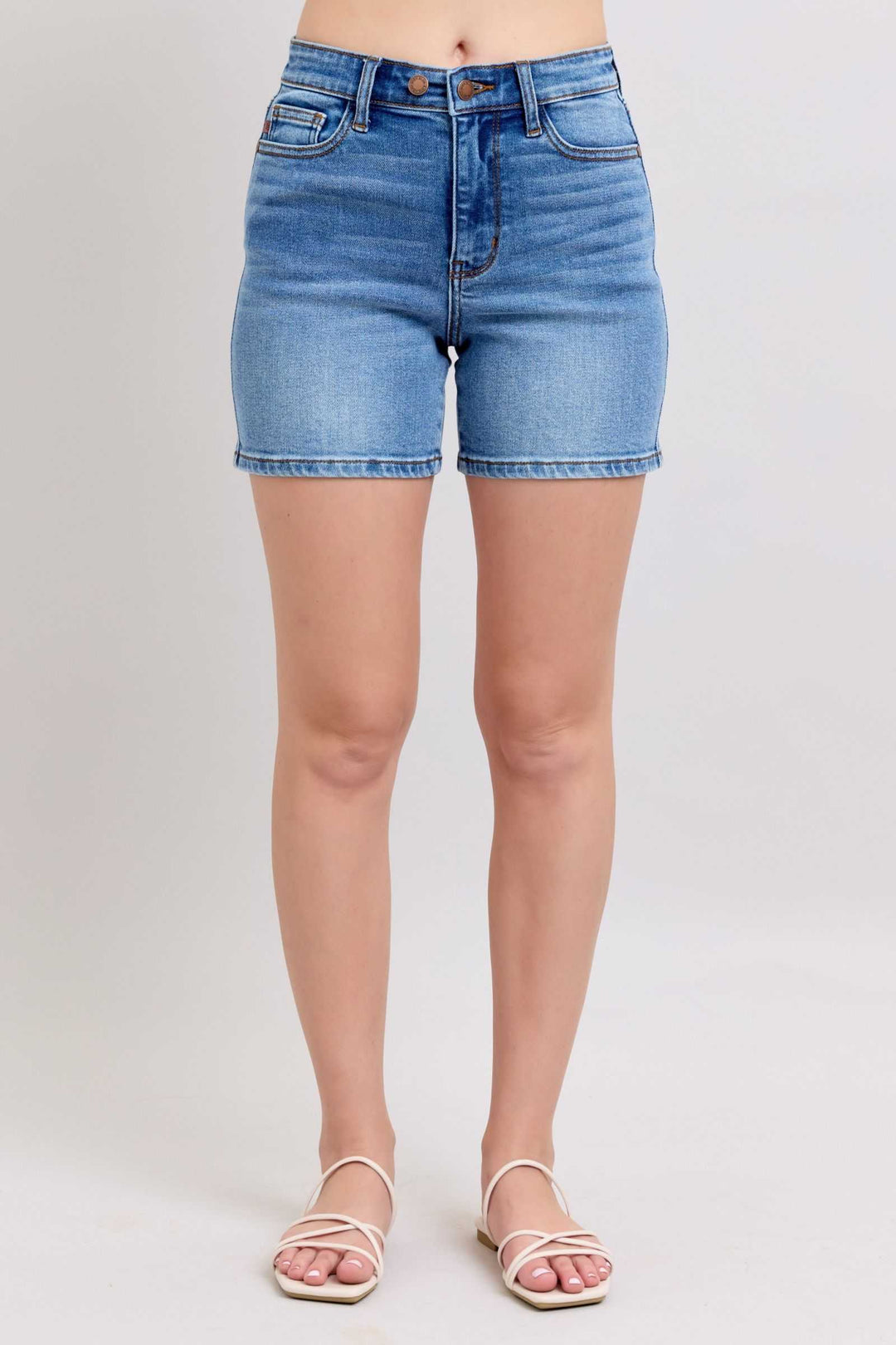 Judy Blue Two Button Denim ShortsElevate your casual look with our 2-button denim shorts featuring convenient pockets for on-the-go essentials. These shorts offer a stylish and comfortable fit, perfJean ShortsJudy Blue Two Button Denim Shorts