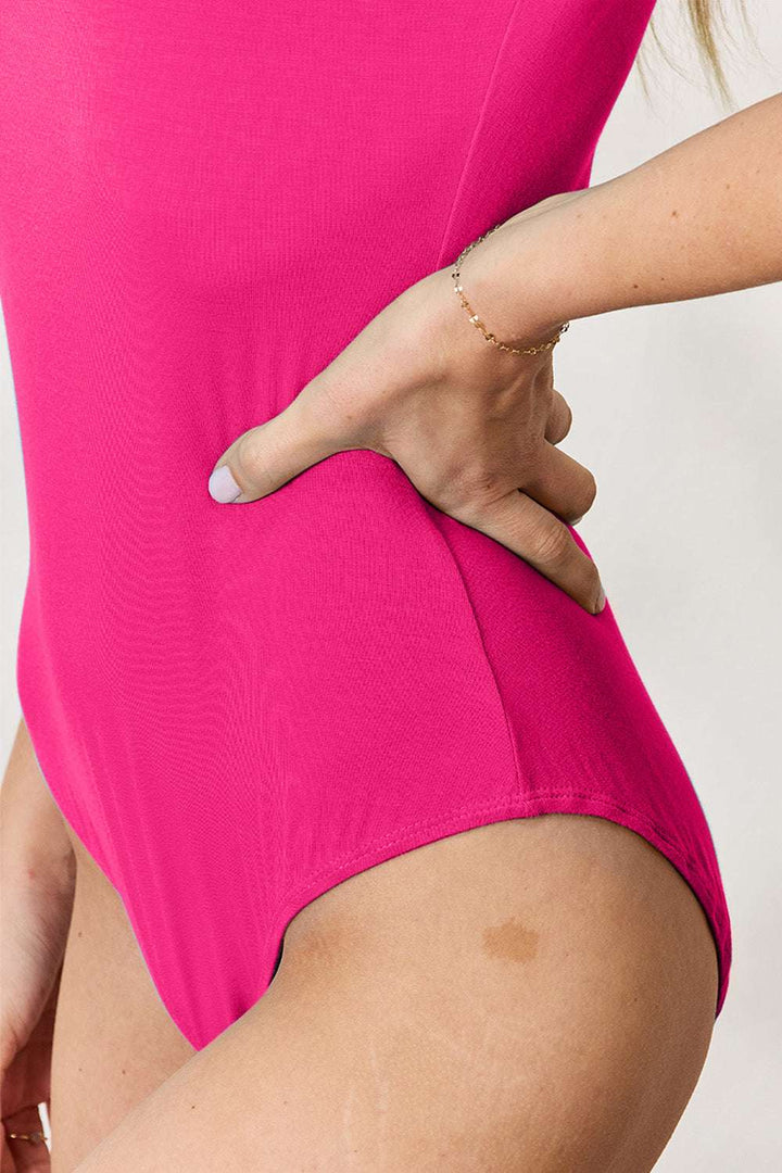 Round Neck Short Sleeve BodysuitBrand: Basic Bae 
Fit: True to size
Features: Basic style
Sheer: Opaque
Stretch: Moderate stretch
Material composition: 95% rayon, 5% spandex
Care instructions: MachBodysuitsRound Neck Short Sleeve Bodysuit