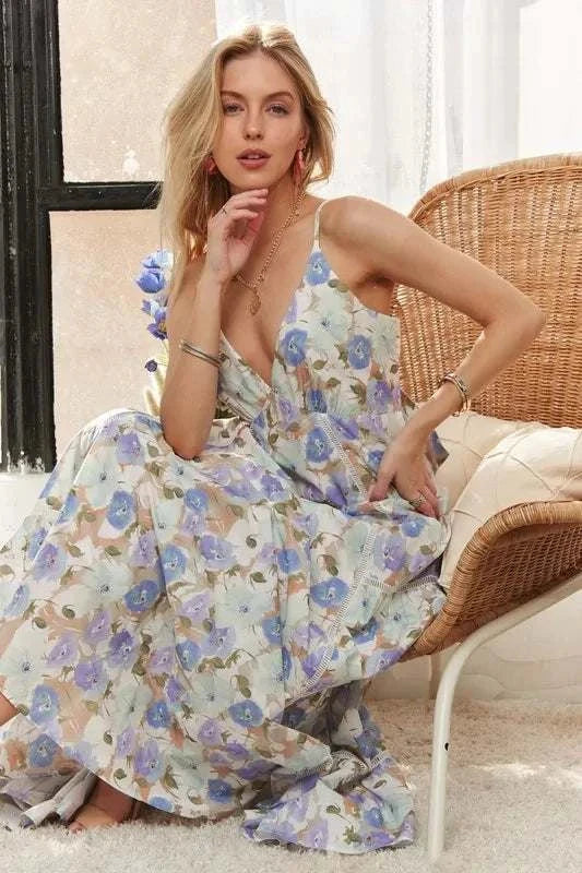 The Bluebell Bloom DressLight, romantic, and full of movement, The Bluebell Bloom Dress features a flowing tiered maxi silhouette with adjustable tie-back detailing. Soft floral prints in pMaxi DressesThe Bluebell Bloom Dress