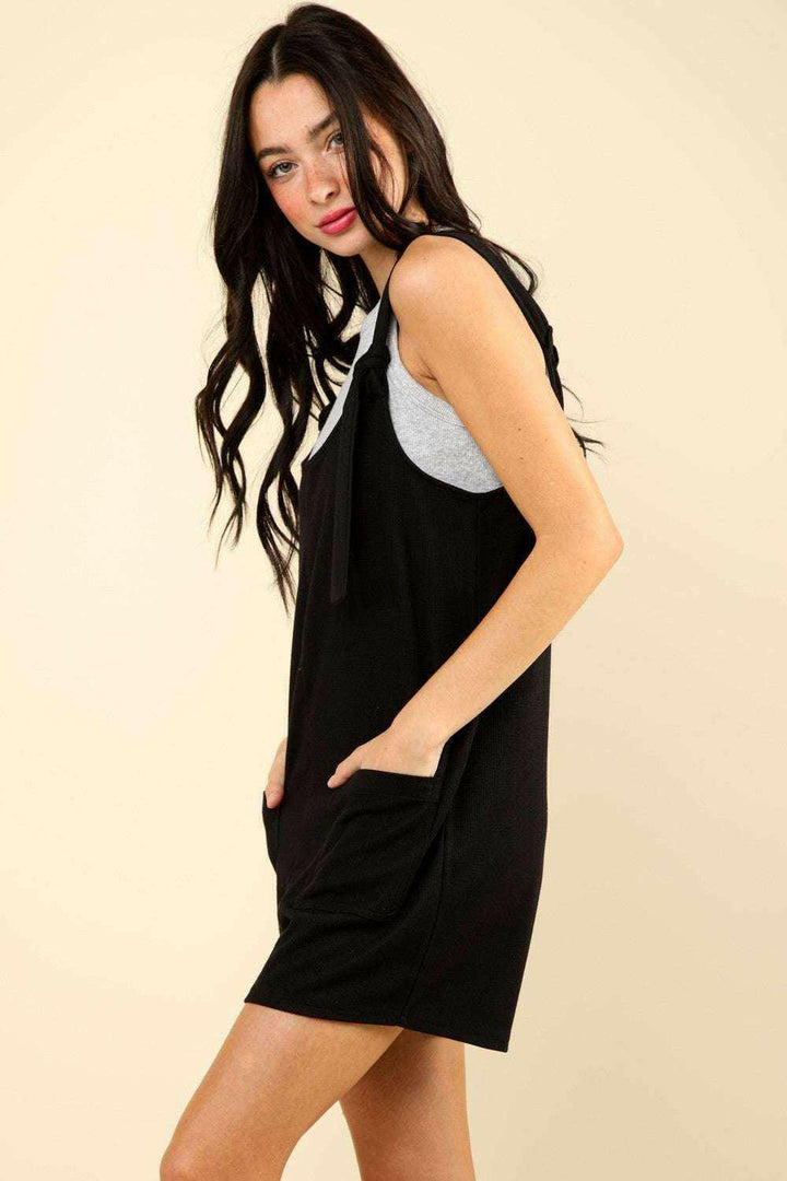 Black Tie Shoulder Front Pocket RomperThe Very J Tie Shoulder Front Pocket Romper is a trendy and comfortable option for any casual event. This cotton blend romper comes with front patch pockets for addeRompersBlack Tie Shoulder