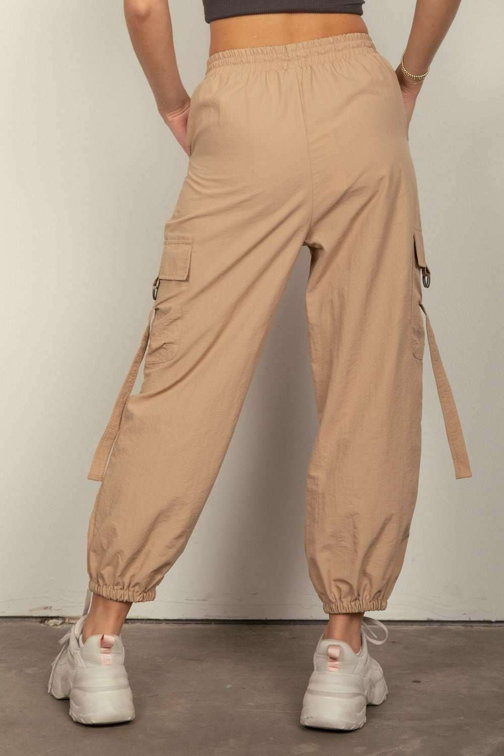 Desert Cargo JoggersStay on-trend with these Y2K-inspired elastic waist solid cargo joggers featuring a utility design perfect for everyday wear. The side pockets and D rings add a toucPantsDesert Cargo Joggers