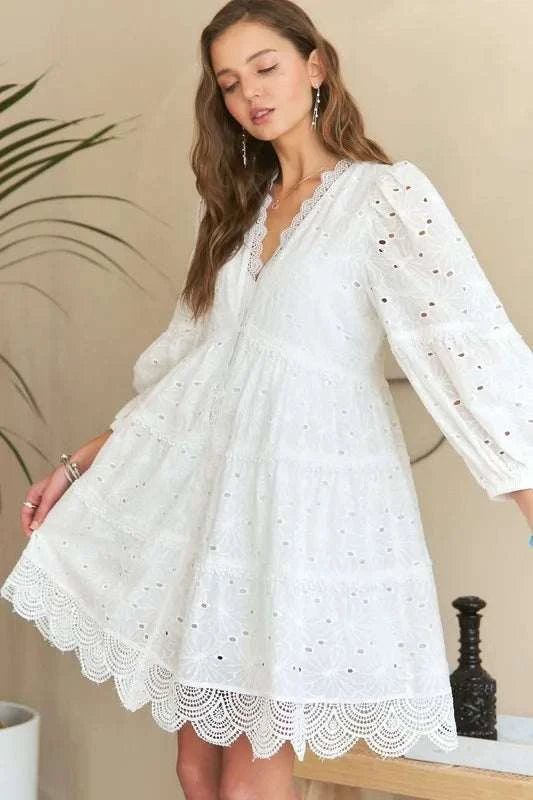 Lace Detail Tiered Eyelet V-Neck Babydoll DressA Lace Detail Tiered Eyelet V-Neck Babydoll Dress is a charming and elegant piece for your wardrobe. The V-neckline and babydoll silhouette offer a flattering and feMini DressesLace Detail Tiered