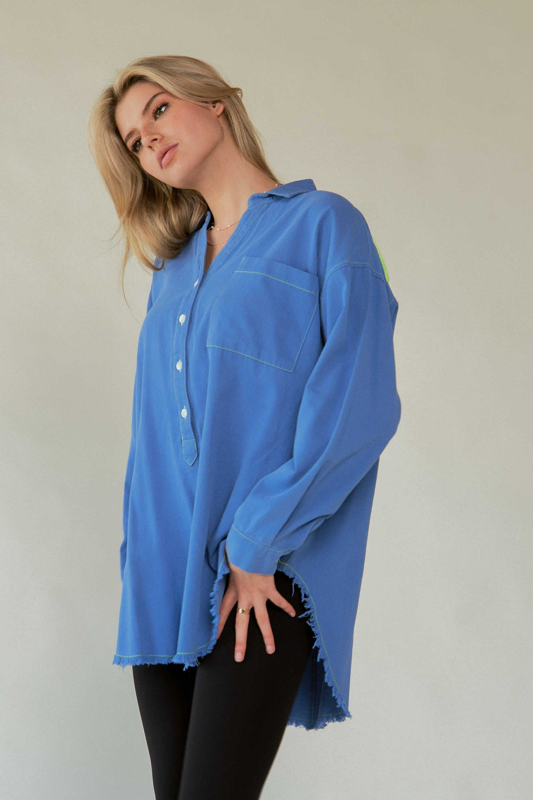 Amor Oversized ShirtLove in every stitch. This oversized 100% cotton button-up shirt features a bold "AMOR" appliqué across the back in plush lettering, adding a playful statement to yoButton-Up ShirtsAmor Oversized Shirt