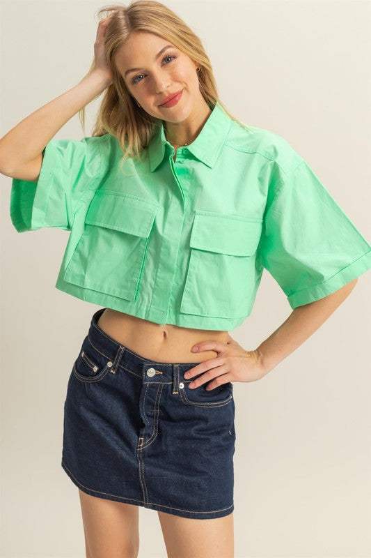 Cotton Poplin Cropped ShirtThe Cotton Poplin Cropped Shirt is a stylish and versatile piece that adds a modern twist to your wardrobe. This crop shirt features front pockets that add a utilitaCrop TopsCotton Poplin Cropped Shirt