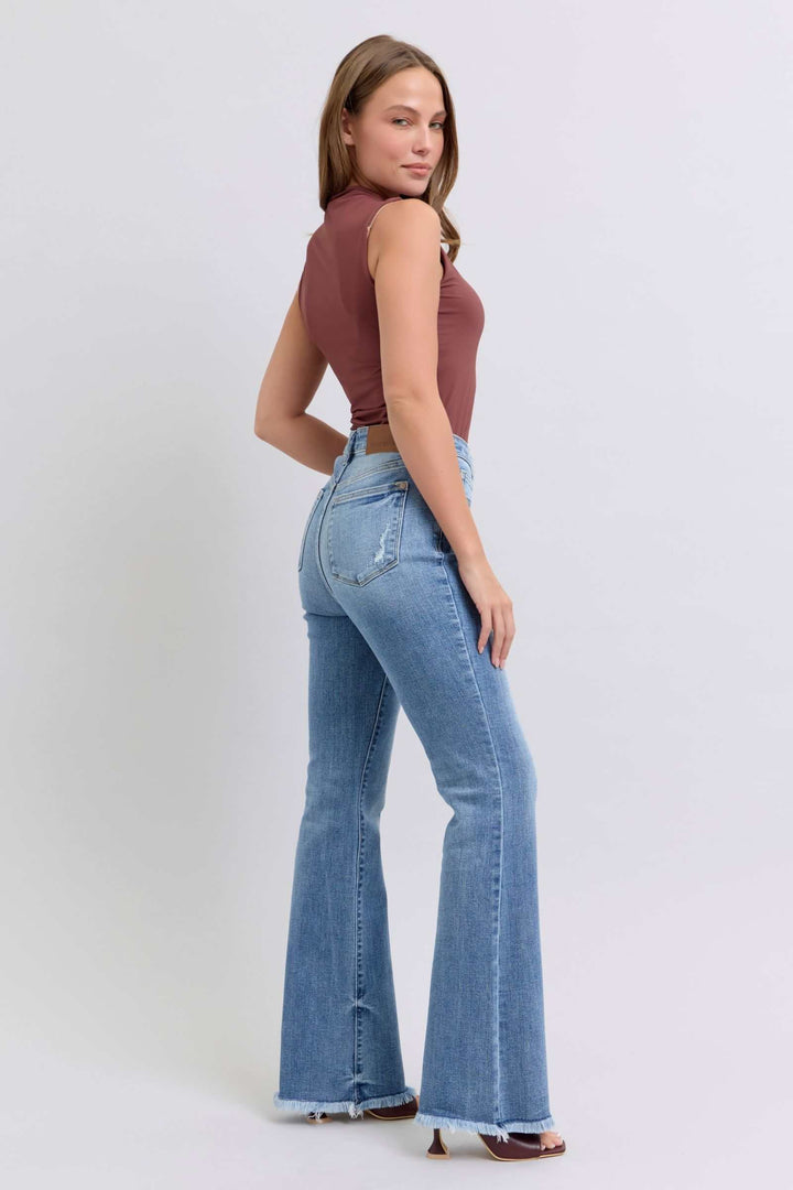 Judy Blue Raw Hem High Rise Bootcut JeansRaw hem high rise bootcut jeans are a trendy and stylish denim option for a fashionable look. These jeans typically feature a high-rise waist that sits above the natBootcut JeansJudy Blue Raw Hem