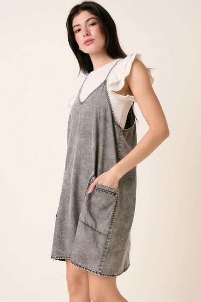 Washed Patch Pocket Mini Cami Denim DressThis washed patch pocket mini cami denim dress is a casual yet stylish addition to your wardrobe. The patch pockets add a touch of functionality and detail, while thMini DressesWashed Patch Pocket Mini Cami Denim Dress