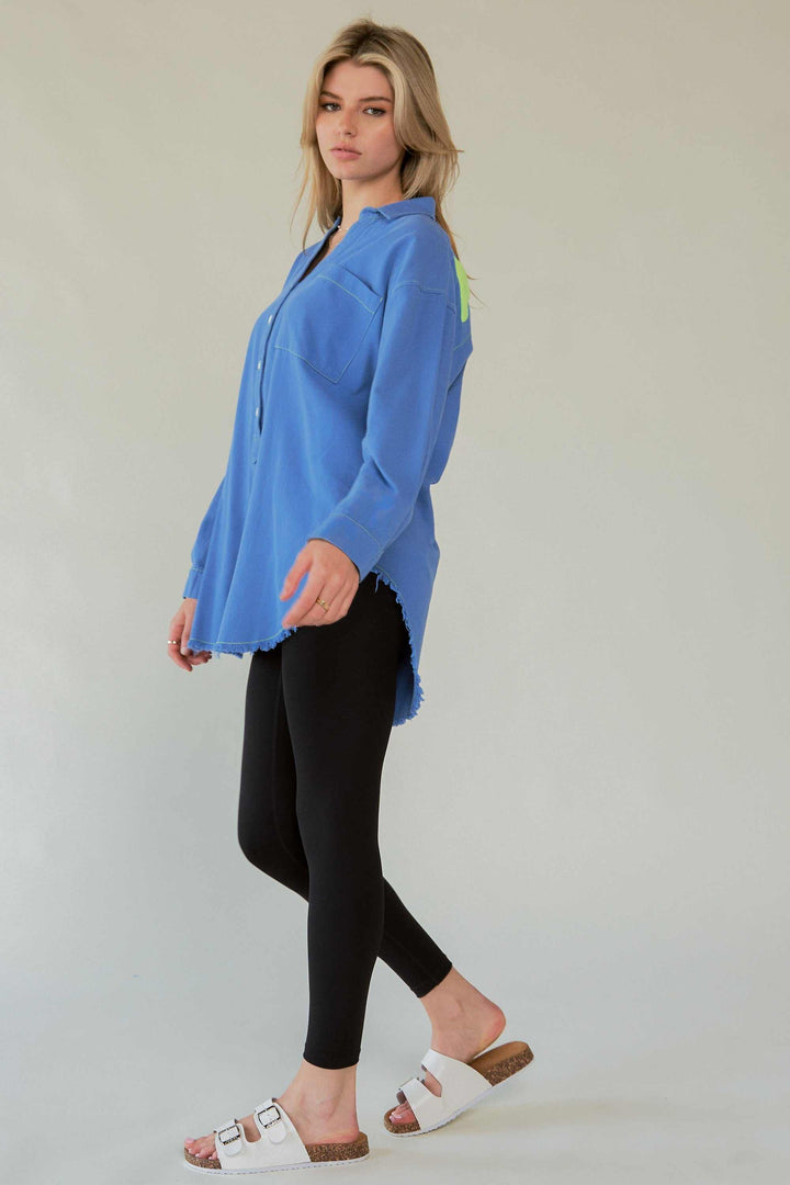 Amor Oversized ShirtLove in every stitch. This oversized 100% cotton button-up shirt features a bold "AMOR" appliqué across the back in plush lettering, adding a playful statement to yoButton-Up ShirtsAmor Oversized Shirt