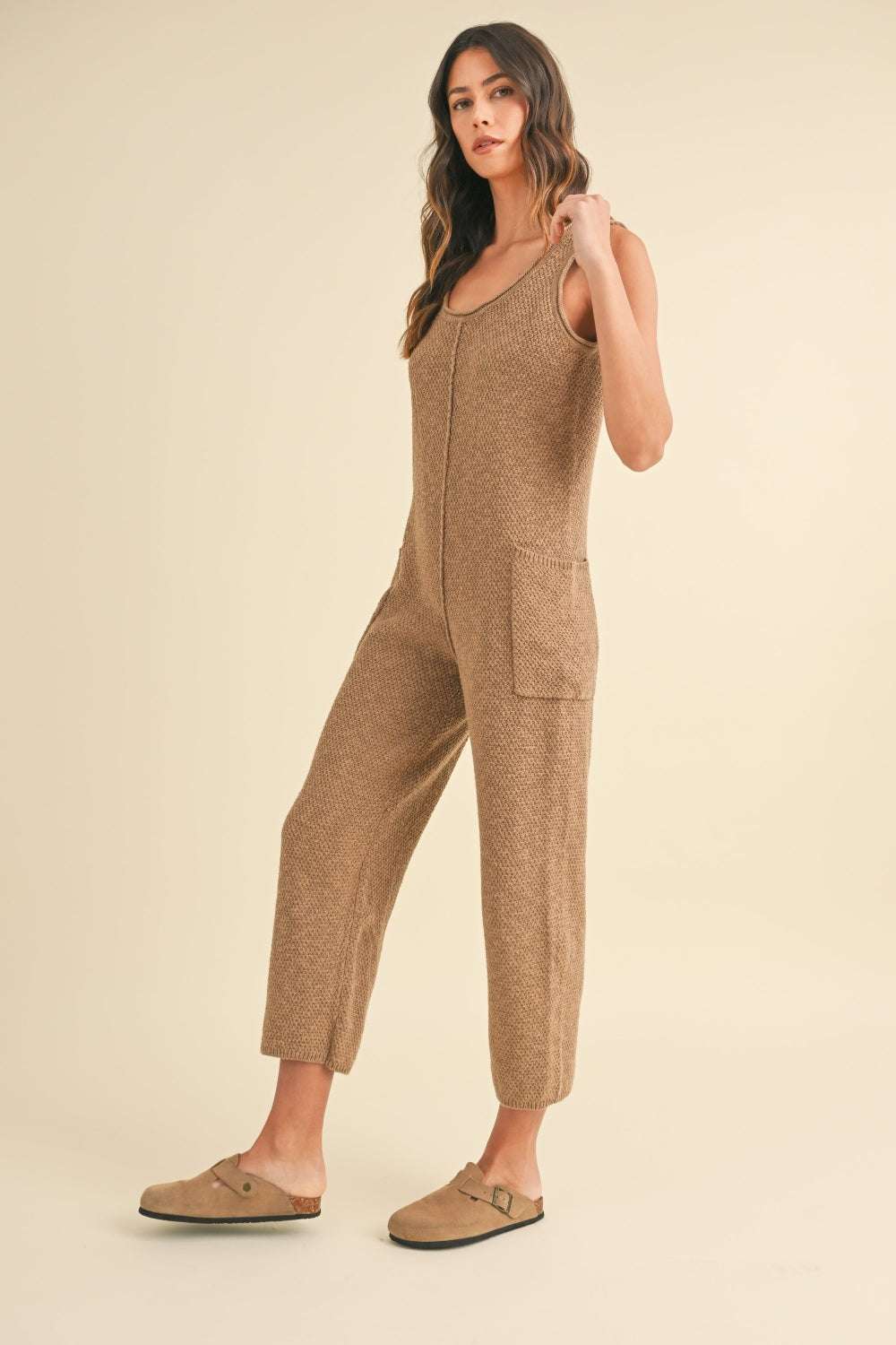 Cotton Knit JumpsuitThis sleeveless 100% cotton knit crop jumpsuit is crafted from a textured sweater knit material, offering both style and comfort. The side pocket detail adds functioJumpsuitsCotton Knit Jumpsuit