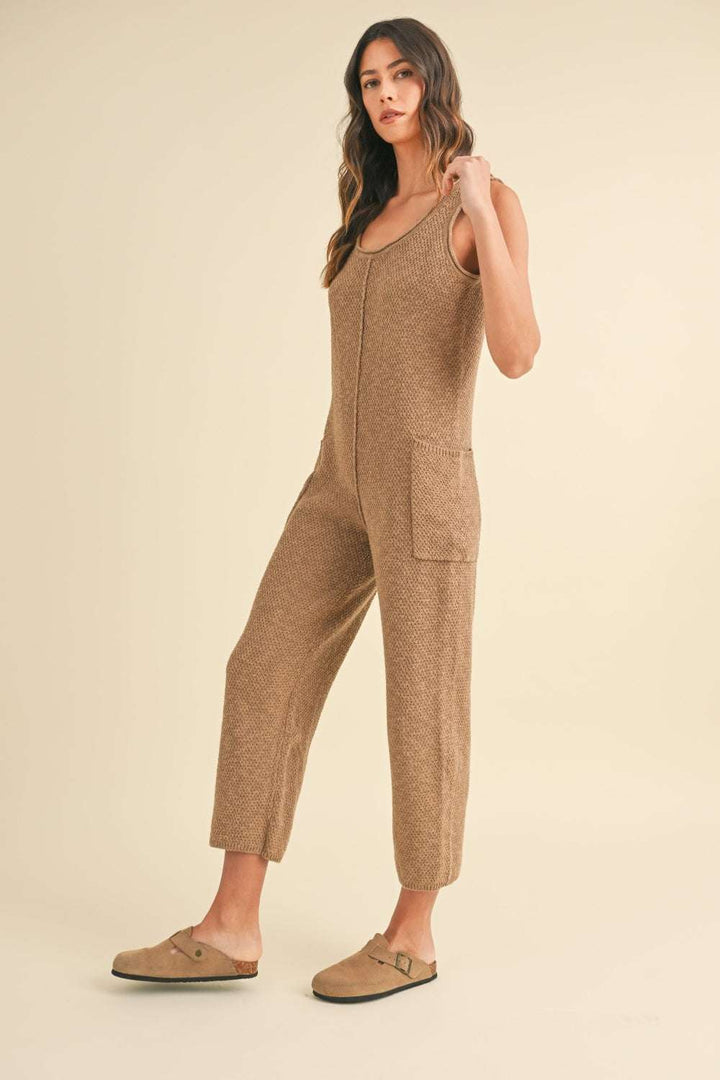 Cotton Knit JumpsuitThis sleeveless 100% cotton knit crop jumpsuit is crafted from a textured sweater knit material, offering both style and comfort. The side pocket detail adds functioJumpsuitsCotton Knit Jumpsuit