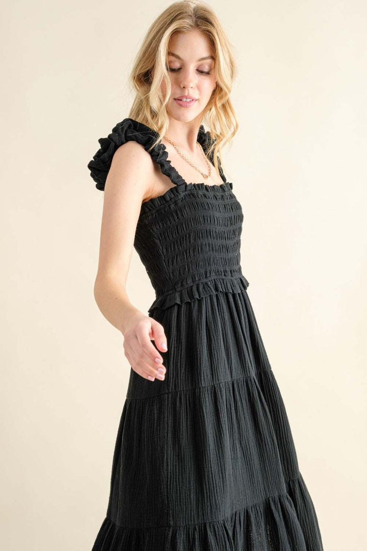 Smocked Ruffled Tiered DressThe Smocked Ruffled Tiered Dress is a charming and feminine 100% cotton piece that exudes effortless style. The smocked bodice provides a comfortable and flattering Midi DressesSmocked Ruffled Tiered Dress