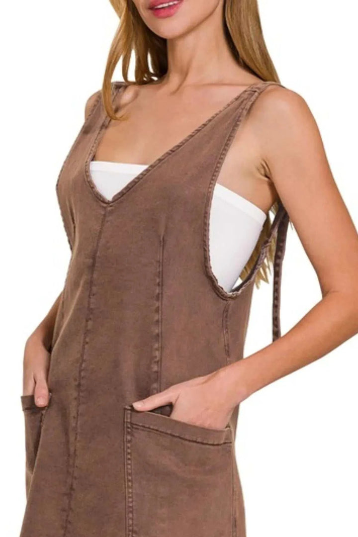 Washed Adjustable Strap Denim Overall DressThis stylish denim dress features a soft coffee washed denim construction with a relaxed, comfortable fit. The deep V-neckline and sleeveless design make it perfect Mini DressesWashed Adjustable Strap