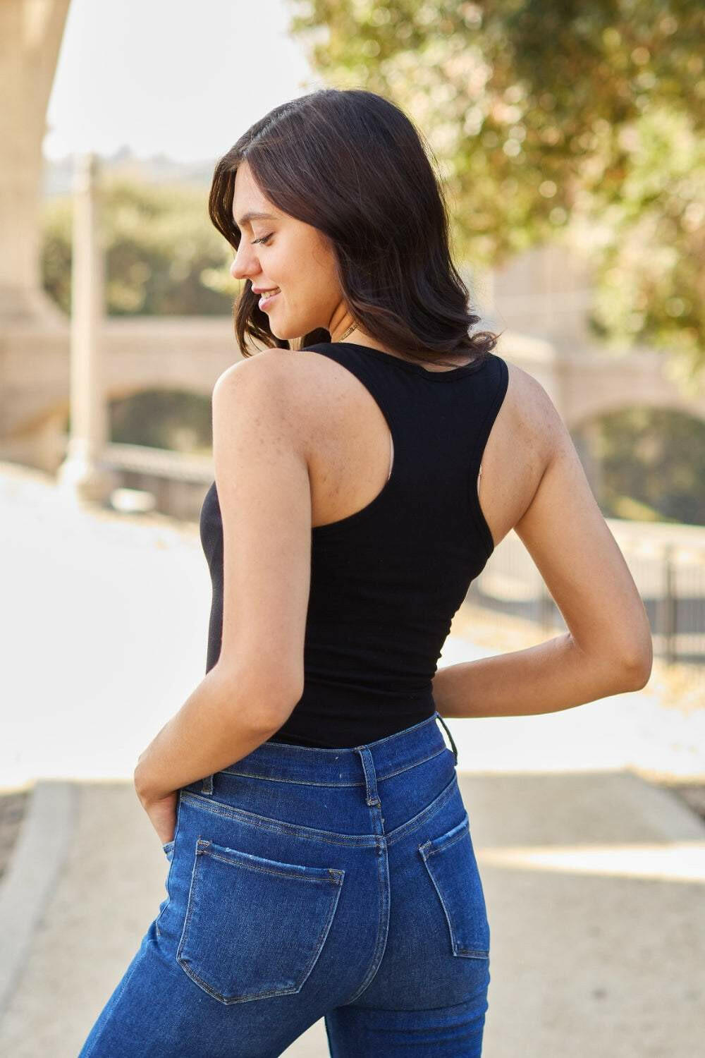 Racerback Tank BodysuitThis chic and flexible cotton blend bodysuit is meant to give you a perfect fit, hugging all the right curves. The racerback style adds a sporty flair, making it ideBodysuitsRacerback Tank Bodysuit