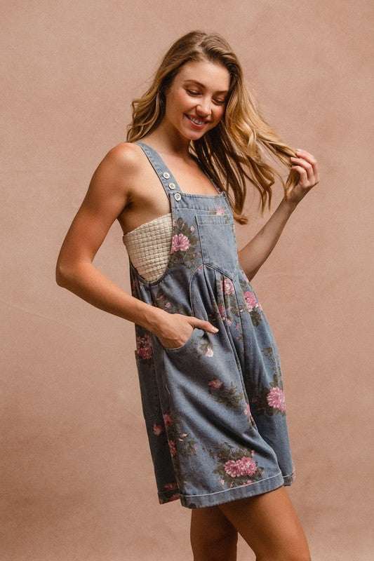 Heirloom Floral OverallsTimeless and effortlessly charming, The Heirloom Floral Overalls blend vintage elegance with casual ease. Crafted from sturdy yet soft cotton denim, these overalls fOverallsHeirloom Floral Overalls