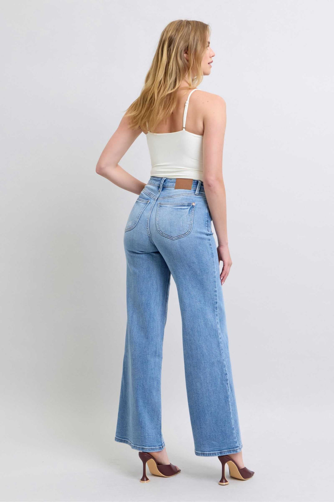 Judy Blue Wide Leg Jeans with PocketsWide Leg Jeans with Pockets are a trendy and versatile option for those looking to make a statement with their outfit. The wide-leg silhouette offers a relaxed and vWide Leg JeansJudy Blue Wide Leg Jeans