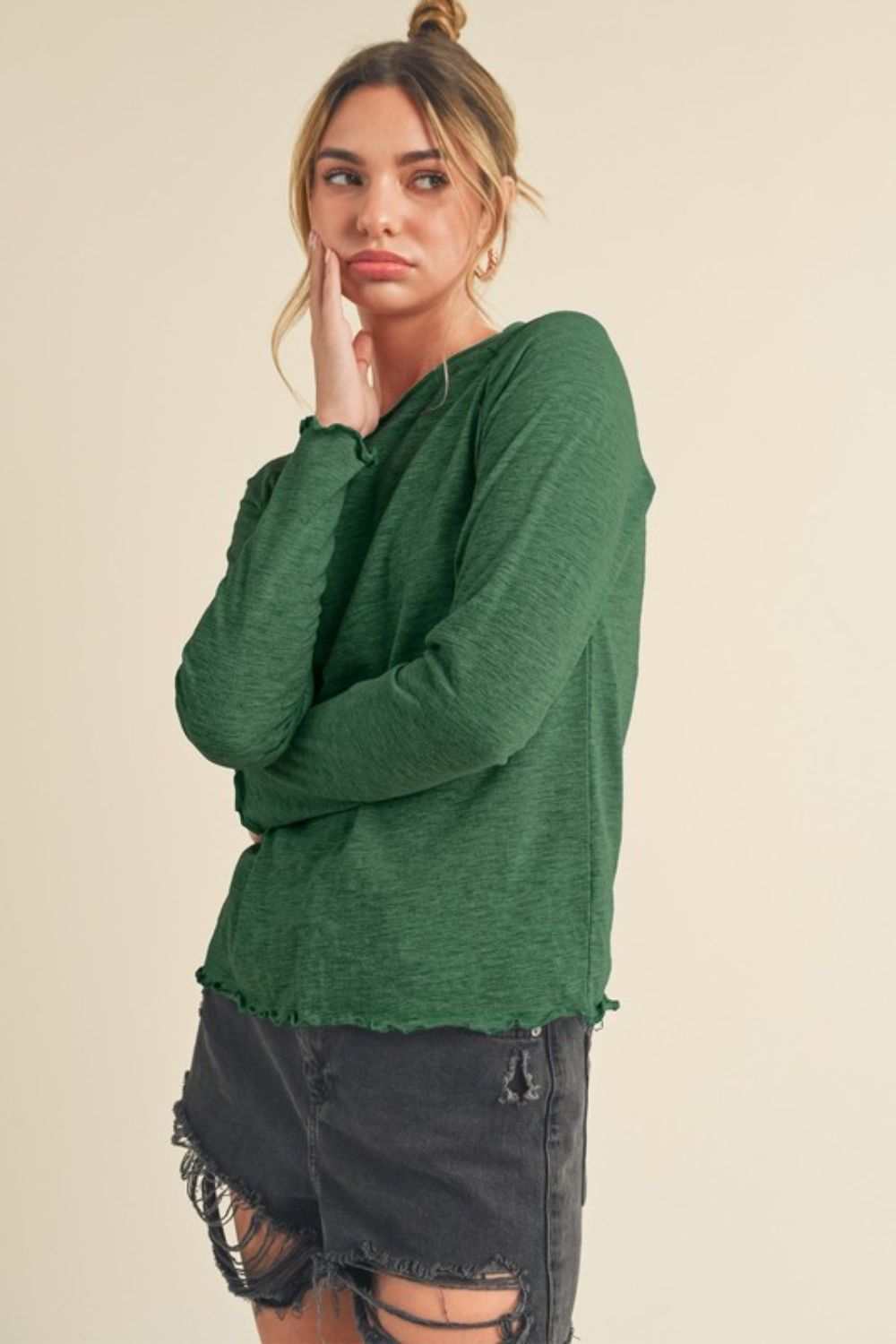 Cotton Lettuce Hem Long Sleeve T-ShirtThe Cotton Lettuce Hem Long Sleeve T-Shirt is a unique piece with a round neckline, raglan sleeves, and a lettuce hemline. This t-shirt features a fun and feminine dT-ShirtsCotton Lettuce Hem