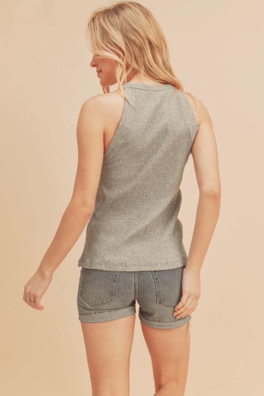 Ribbed Round Neck TankThe Ribbed Round Neck Tank is a classic and versatile piece that belongs in every wardrobe. Featuring a round neckline and ribbed texture, this tank top offers a timTank TopsRibbed Round Neck Tank
