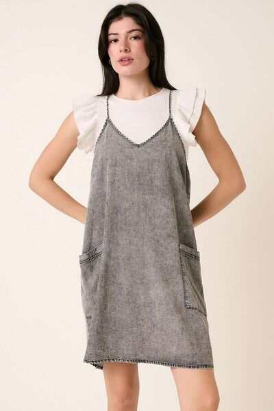 Washed Patch Pocket Mini Cami Denim DressThis washed patch pocket mini cami denim dress is a casual yet stylish addition to your wardrobe. The patch pockets add a touch of functionality and detail, while thMini DressesWashed Patch Pocket Mini Cami Denim Dress