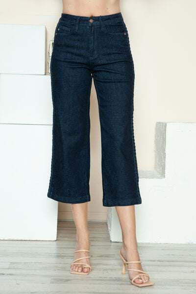 Judy Blue Side Seam Braid Detail Crop Wide Leg JeansThe High Rise side seam braid detail crop wide leg jeans offer a contemporary twist on classic denim. Featuring a unique braided detail along the side seams, these jCropped JeansJudy Blue Side Seam