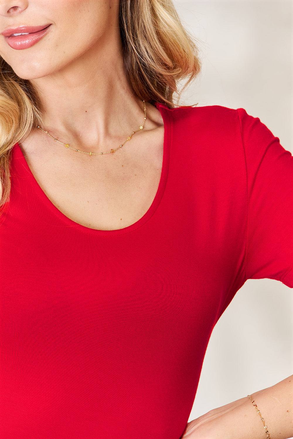Round Neck Short Sleeve BodysuitBrand: Basic Bae 
Fit: True to size
Features: Basic style
Sheer: Opaque
Stretch: Moderate stretch
Material composition: 95% rayon, 5% spandex
Care instructions: MachBodysuitsRound Neck Short Sleeve Bodysuit