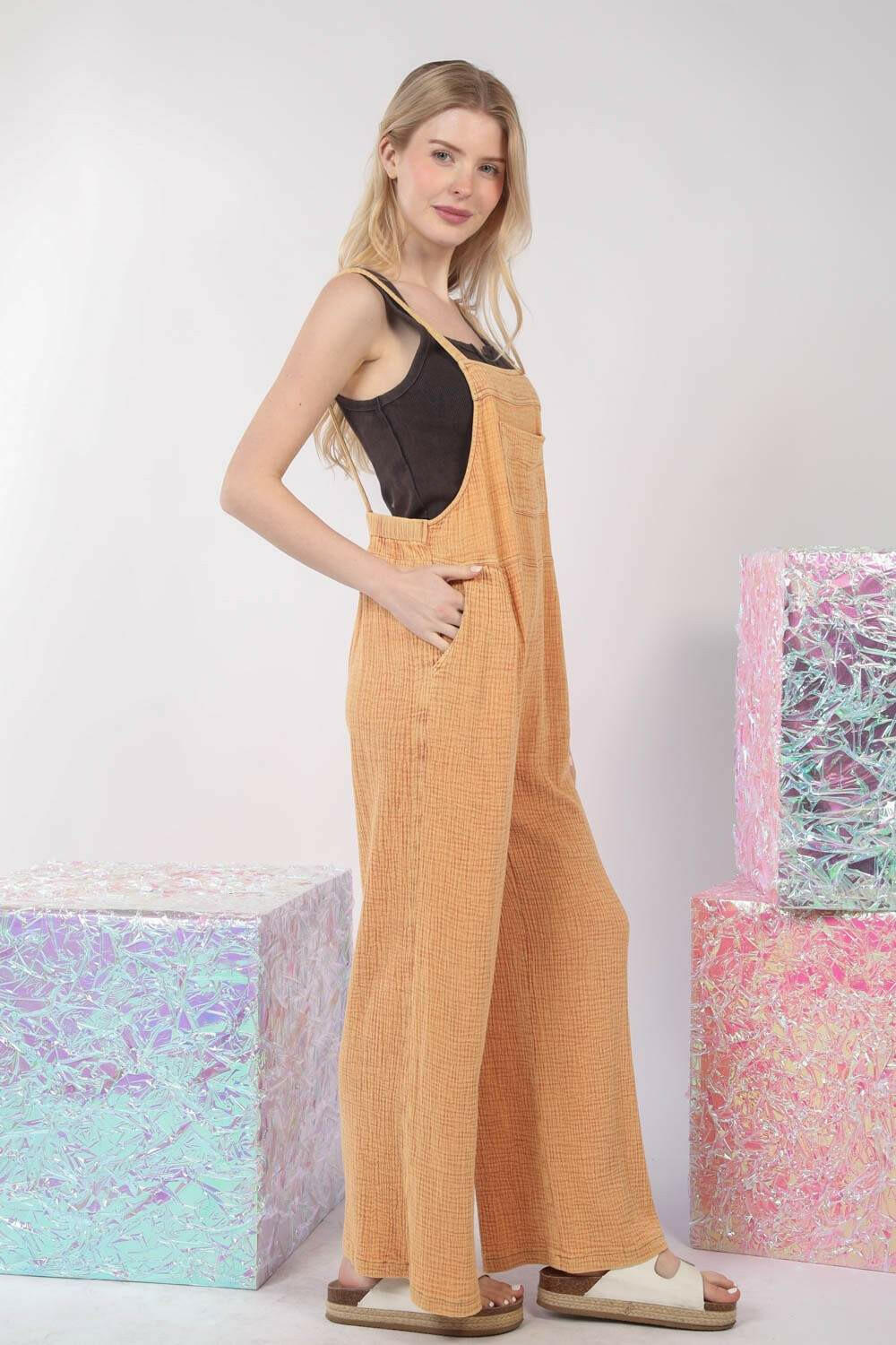 Textured Cotton Overalls - TangerineStep into sunny days with our Tangerine Cotton Overalls. This vibrant piece is designed with a relaxed, wide-leg fit and a classic square neckline, making it perfectOverallsTextured Cotton Overalls