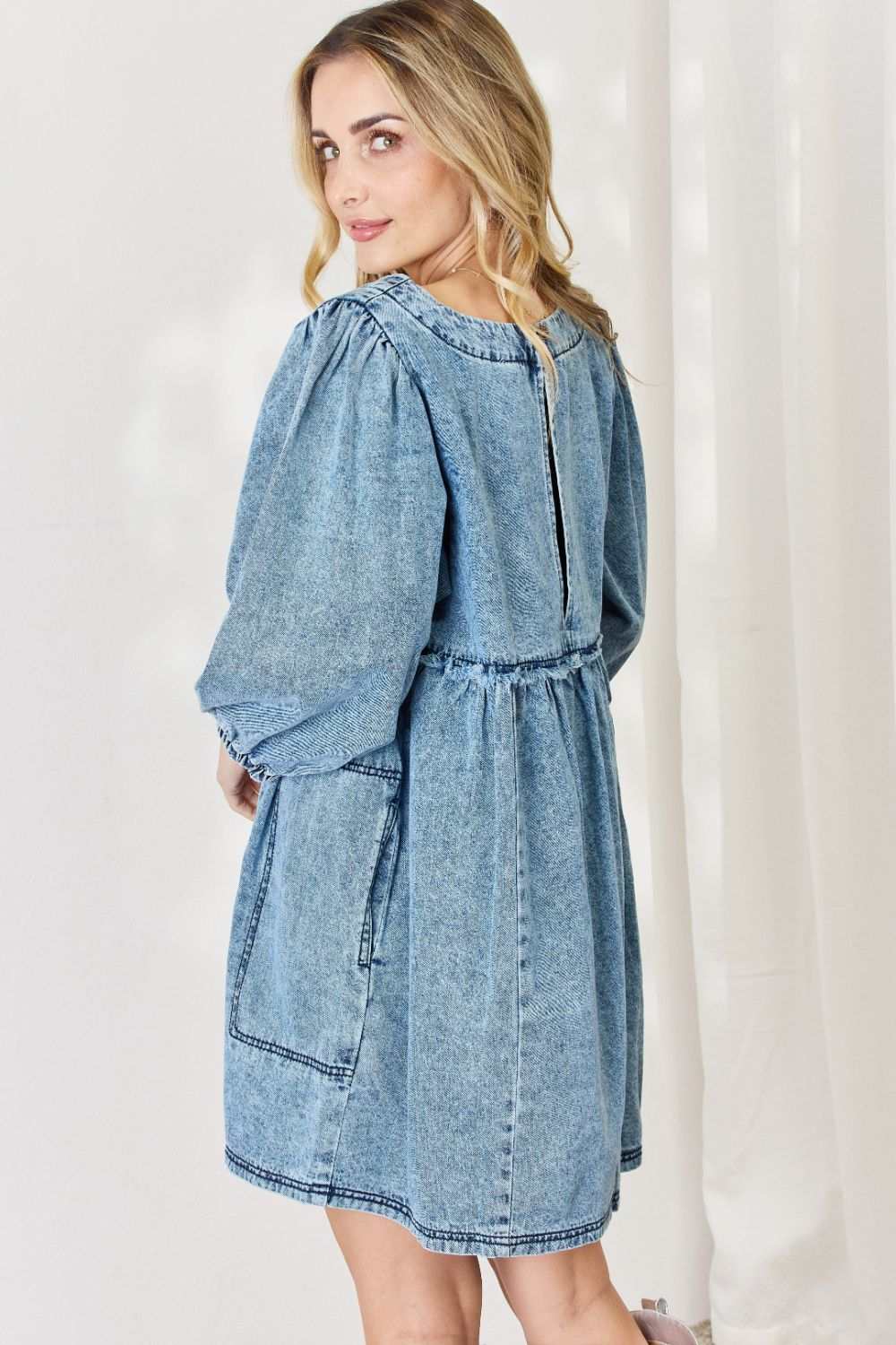 Oversized Denim Babydoll DressThis dress boasts a relaxed, oversized fit that flatters all body types. The babydoll silhouette adds a touch of playful femininity, while the balloon sleeves exude Mini DressesOversized Denim Babydoll Dress