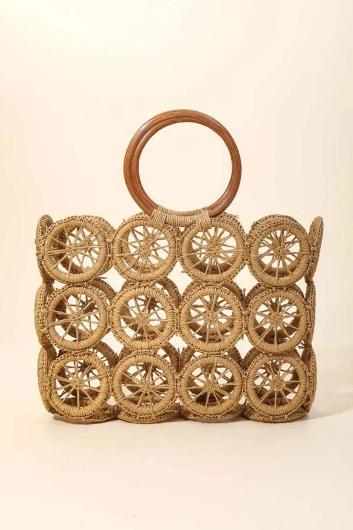 Fame Intricate Braided Wheels HandbagThe Intricate Braided Wheels Handbag is a stunning accessory designed with intricate braided detailing in the shape of wheels. This handbag exudes a unique and artisHandbagsFame Intricate Braided Wheels