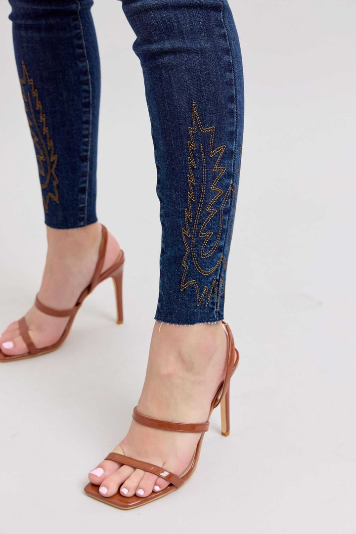Judy Blue Embroidered High Rise Skinny JeansEmbroidered High Rise Skinny Jeans are a stylish and on-trend addition to any wardrobe. These jeans feature intricate and eye-catching embroidery details that add a Skinny JeansJudy Blue Embroidered High Rise Skinny Jeans