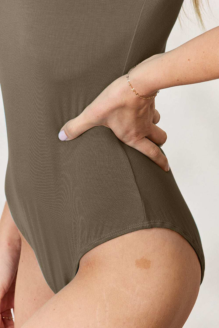 Round Neck Short Sleeve BodysuitBrand: Basic Bae 
Fit: True to size
Features: Basic style
Sheer: Opaque
Stretch: Moderate stretch
Material composition: 95% rayon, 5% spandex
Care instructions: MachBodysuitsRound Neck Short Sleeve Bodysuit
