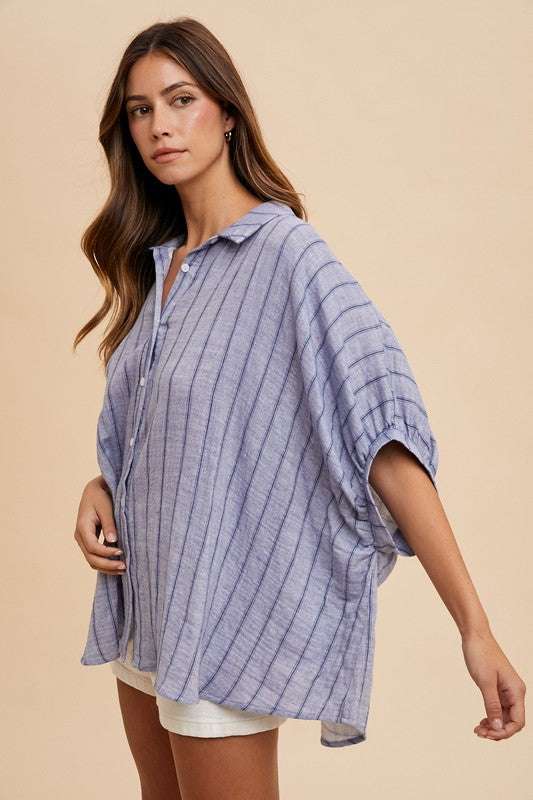 Coastal Breeze Oversized ShirtA striped button-up half sleeve shirt is a fashionable and versatile piece that can be worn in various settings. This type of shirt typically features a classic buttButton-Up ShirtsCoastal Breeze Oversized Shirt