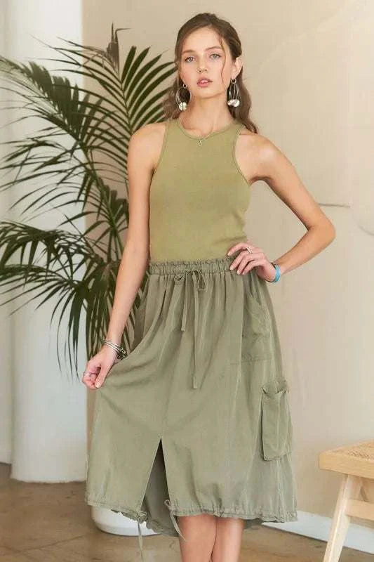 Drawstring Sleeveless Washed DressThe Drawstring Sleeveless Washed Dress is a casual yet stylish piece for everyday wear. With its sleeveless design and relaxed silhouette, this dress offers both comMidi DressesDrawstring Sleeveless Dress