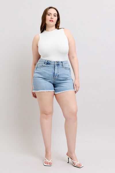 Judy Blue Tummy Control Raw Hem Denim ShortsThe tummy control raw hem denim shorts are designed to provide a slimming effect around the waist area while also featuring a trendy raw hem finish at the bottom. ThJean ShortsJudy Blue Tummy Control