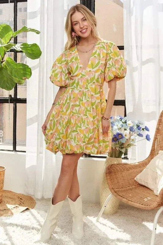 The Sunlit Petal DressSoft and luminous, The Sunlit Petal Dress captures the lightness of a warm morning in full bloom. Featuring puff sleeves, a softly flared mini silhouette, and a vibrMini DressesThe Sunlit Petal Dress