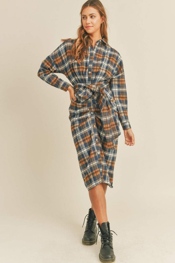 Plaid Flannel Shirt DressThis cotton and chenille shirt dress features a classic plaid flannel pattern in a versatile and stylish design. With a front tie detail, it adds a touch of femininiMidi DressesPlaid Flannel Shirt