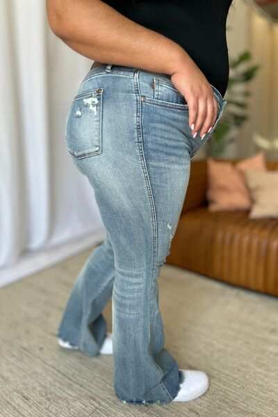 Judy Blue Medium Rise Tummy Control Destroyed FlareThe medium rise tummy control destroy flare jeans are designed to enhance your silhouette while providing ultimate comfort. Featuring a flattering fit, these jeans oFlare JeansJudy Blue Medium Rise