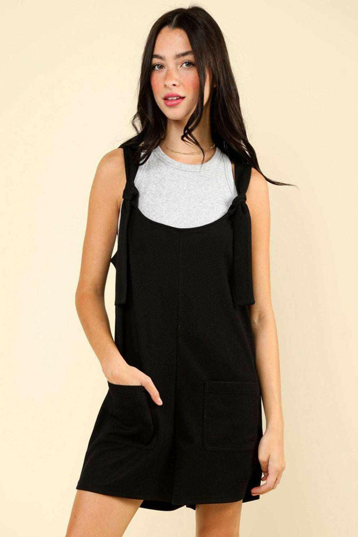 Black Tie Shoulder Front Pocket RomperThe Very J Tie Shoulder Front Pocket Romper is a trendy and comfortable option for any casual event. This cotton blend romper comes with front patch pockets for addeRompersBlack Tie Shoulder
