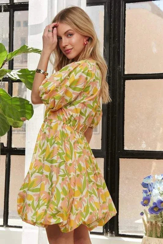 The Sunlit Petal DressSoft and luminous, The Sunlit Petal Dress captures the lightness of a warm morning in full bloom. Featuring puff sleeves, a softly flared mini silhouette, and a vibrMini DressesThe Sunlit Petal Dress