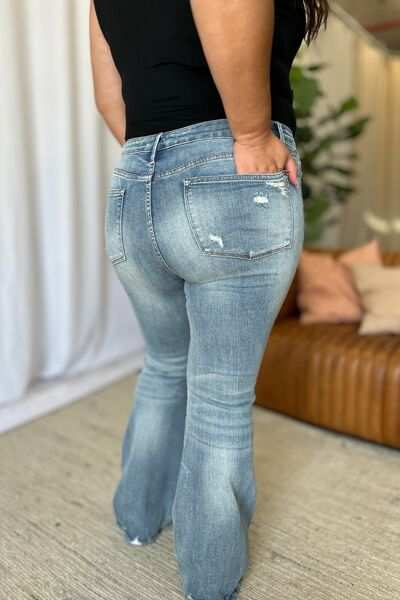 Judy Blue Medium Rise Tummy Control Destroyed FlareThe medium rise tummy control destroy flare jeans are designed to enhance your silhouette while providing ultimate comfort. Featuring a flattering fit, these jeans oFlare JeansJudy Blue Medium Rise