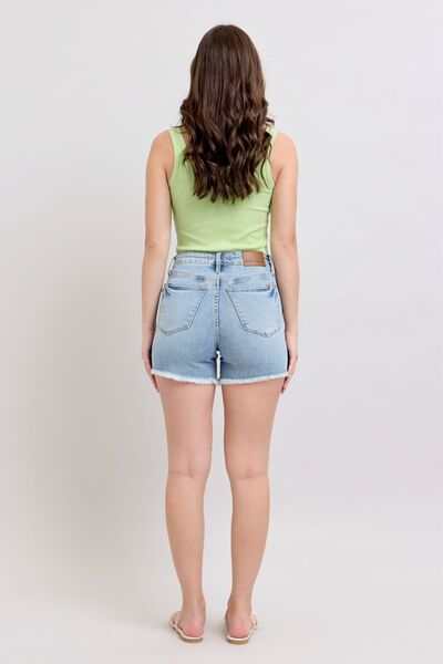Judy Blue Tummy Control Raw Hem Denim ShortsThe tummy control raw hem denim shorts are designed to provide a slimming effect around the waist area while also featuring a trendy raw hem finish at the bottom. ThJean ShortsJudy Blue Tummy Control