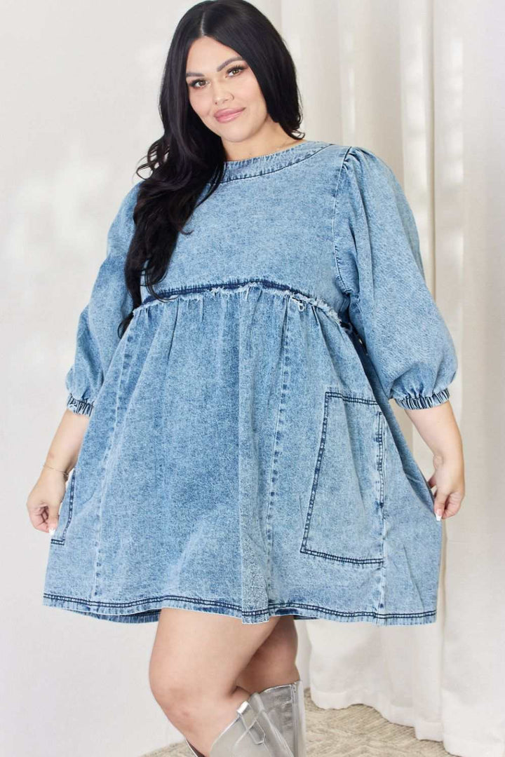 Oversized Denim Babydoll DressThis dress boasts a relaxed, oversized fit that flatters all body types. The babydoll silhouette adds a touch of playful femininity, while the balloon sleeves exude Mini DressesOversized Denim Babydoll Dress
