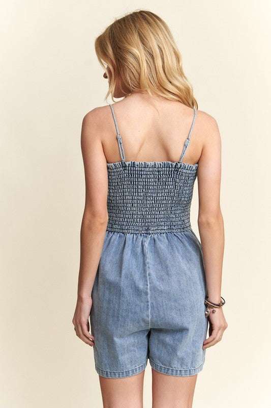 Smocked Spaghetti Strap Denim RomperA smocked spaghetti strap denim romper is a trendy and versatile one-piece 100% cotton outfit that features a smocked bodice, thin spaghetti straps, and denim fabricRompersSmocked Spaghetti Strap