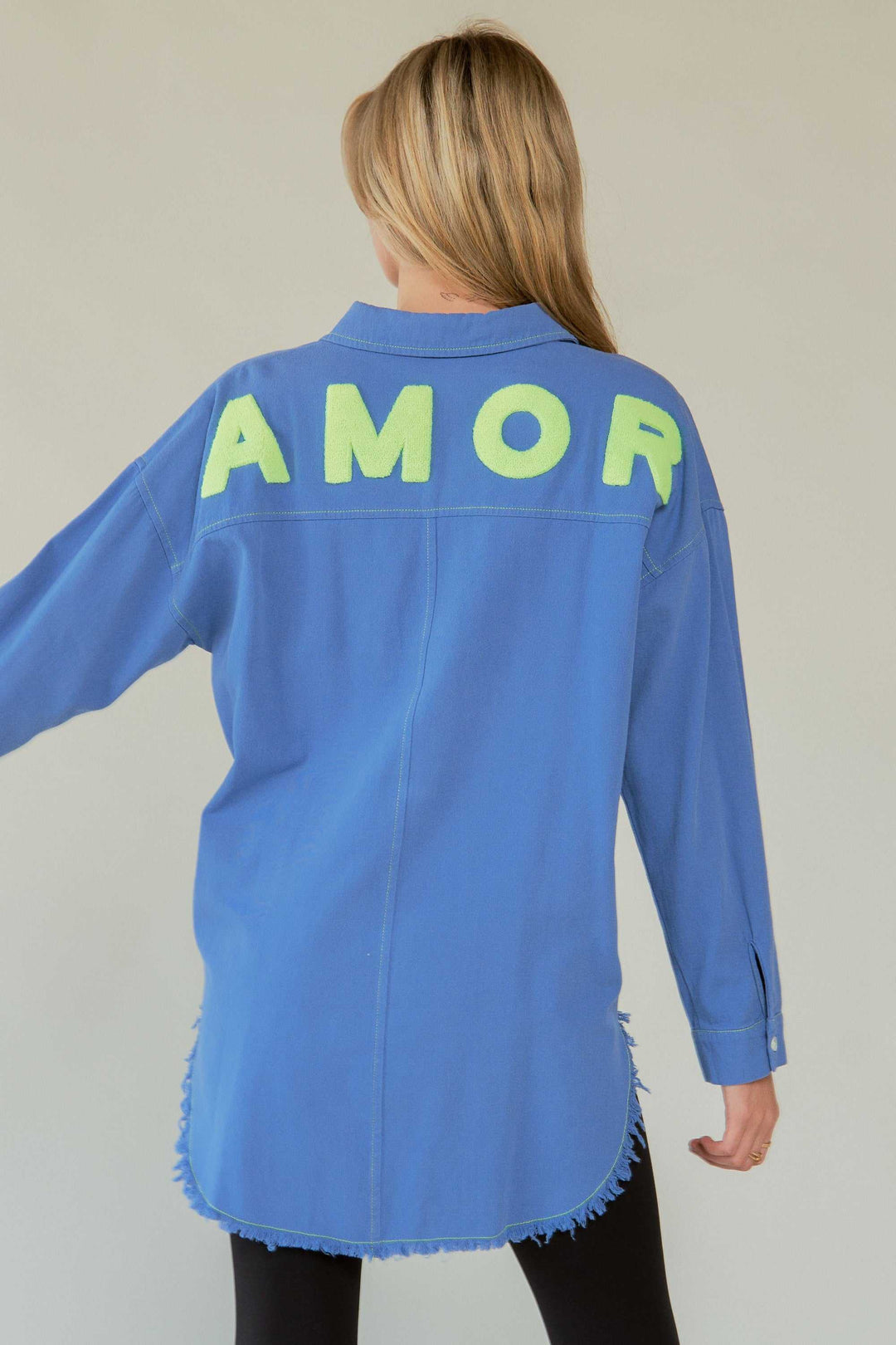 Amor Oversized ShirtLove in every stitch. This oversized 100% cotton button-up shirt features a bold "AMOR" appliqué across the back in plush lettering, adding a playful statement to yoButton-Up ShirtsAmor Oversized Shirt