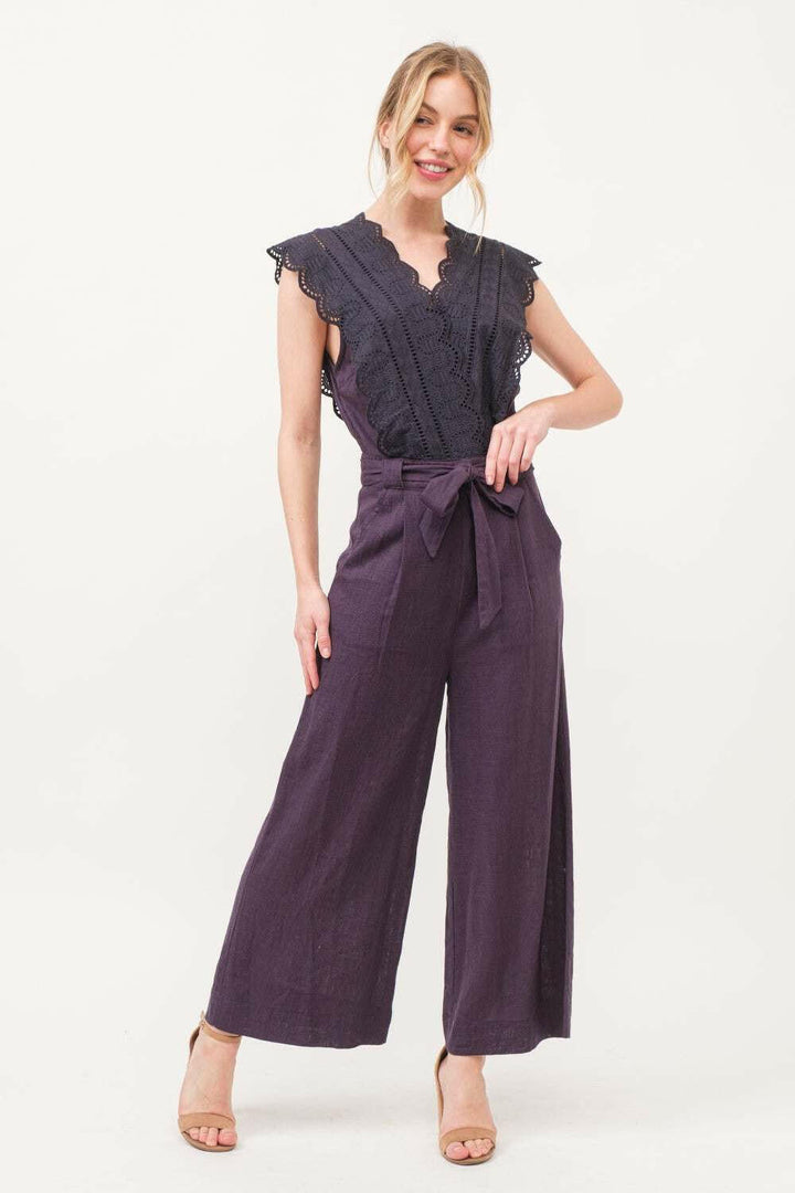 Plum Elegance Lace JumpsuitThe Plum Elegance Lace Jumpsuit is a chic and sophisticated piece that combines elegance with modern style. Featuring a laced surplice neckline and a flattering tie JumpsuitsPlum Elegance Lace Jumpsuit