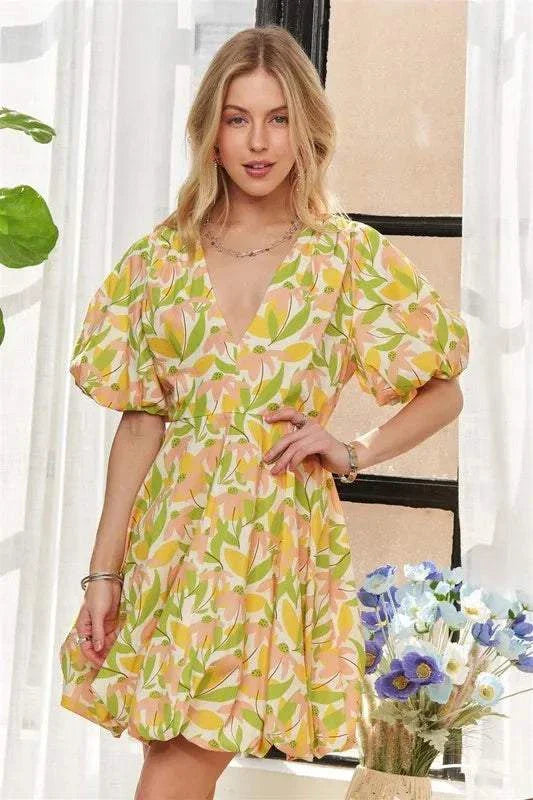 The Sunlit Petal DressSoft and luminous, The Sunlit Petal Dress captures the lightness of a warm morning in full bloom. Featuring puff sleeves, a softly flared mini silhouette, and a vibrMini DressesThe Sunlit Petal Dress