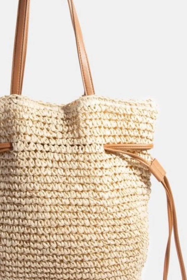 Fame Faux Leather Straps Braided Tote BagThis faux leather straps braided tote bag is a sophisticated and stylish accessory that adds a touch of elegance to any ensemble. The combination of faux leather andTote BagsFame Faux Leather