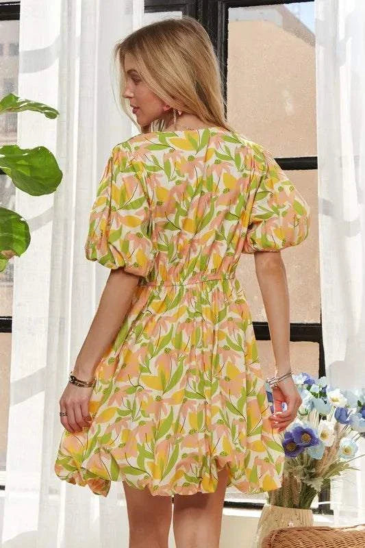 The Sunlit Petal DressSoft and luminous, The Sunlit Petal Dress captures the lightness of a warm morning in full bloom. Featuring puff sleeves, a softly flared mini silhouette, and a vibrMini DressesThe Sunlit Petal Dress