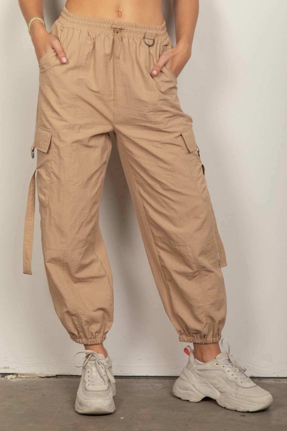 Desert Cargo JoggersStay on-trend with these Y2K-inspired elastic waist solid cargo joggers featuring a utility design perfect for everyday wear. The side pockets and D rings add a toucPantsDesert Cargo Joggers
