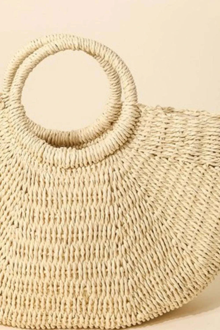 Fame Half Moon Straw Tote BagThe Half Moon Straw Tote Bag is a charming and practical accessory crafted from durable straw material. Its unique half-moon shape adds a modern and trendy touch to Tote BagsHalf Moon Straw Tote Bag