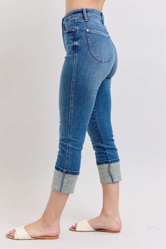 Judy Blue Skinny Cuff Capris JeansSkinny cuff capris jeans are a trendy style of jeans that are fitted through the legs and end in a cuffed hem. They are a great option for a casual and chic look, peCropped JeansJudy Blue Skinny Cuff Capris Jeans