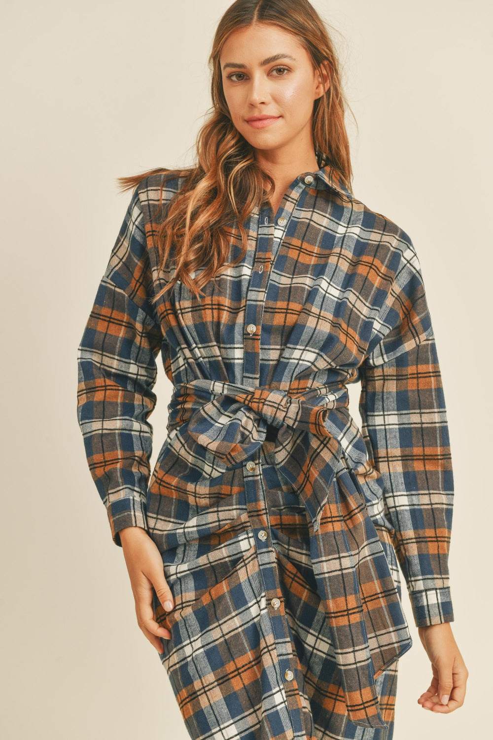 Plaid Flannel Shirt DressThis cotton and chenille shirt dress features a classic plaid flannel pattern in a versatile and stylish design. With a front tie detail, it adds a touch of femininiMidi DressesPlaid Flannel Shirt